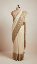 Ivory georgette saree with antique gold border